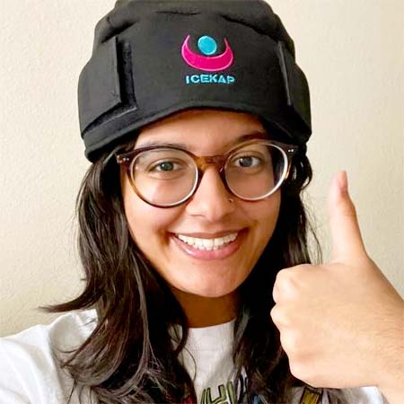 Girl wearing Icekap and giving thumbs-up