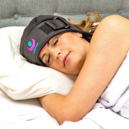 Girl wearing Icekap and sleeping with head on pillow
